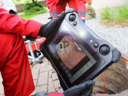 Plumbing Technician Inspecting Sewer via Video in Wheeling, IL