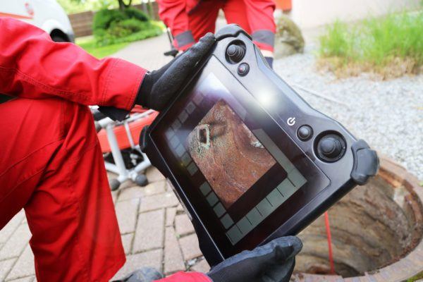 Plumbing Technician Inspecting Sewer via Video in Wheeling, IL